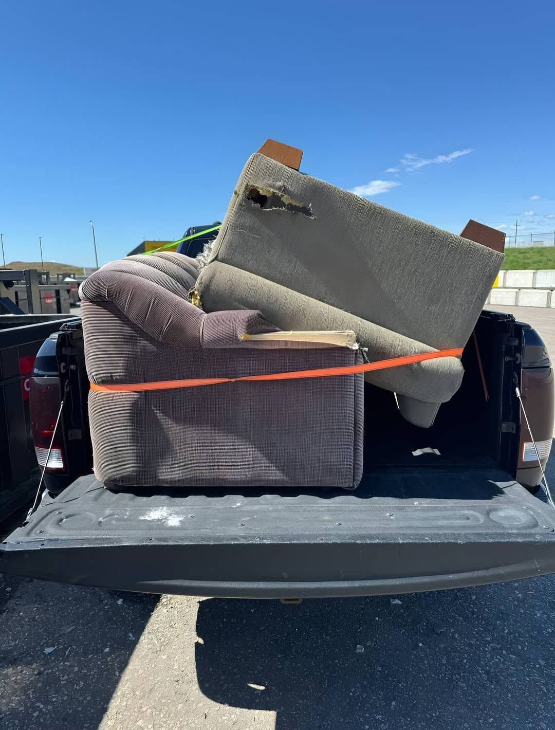 Recliner and old carpet loaded for disposal at the Calgary landfill